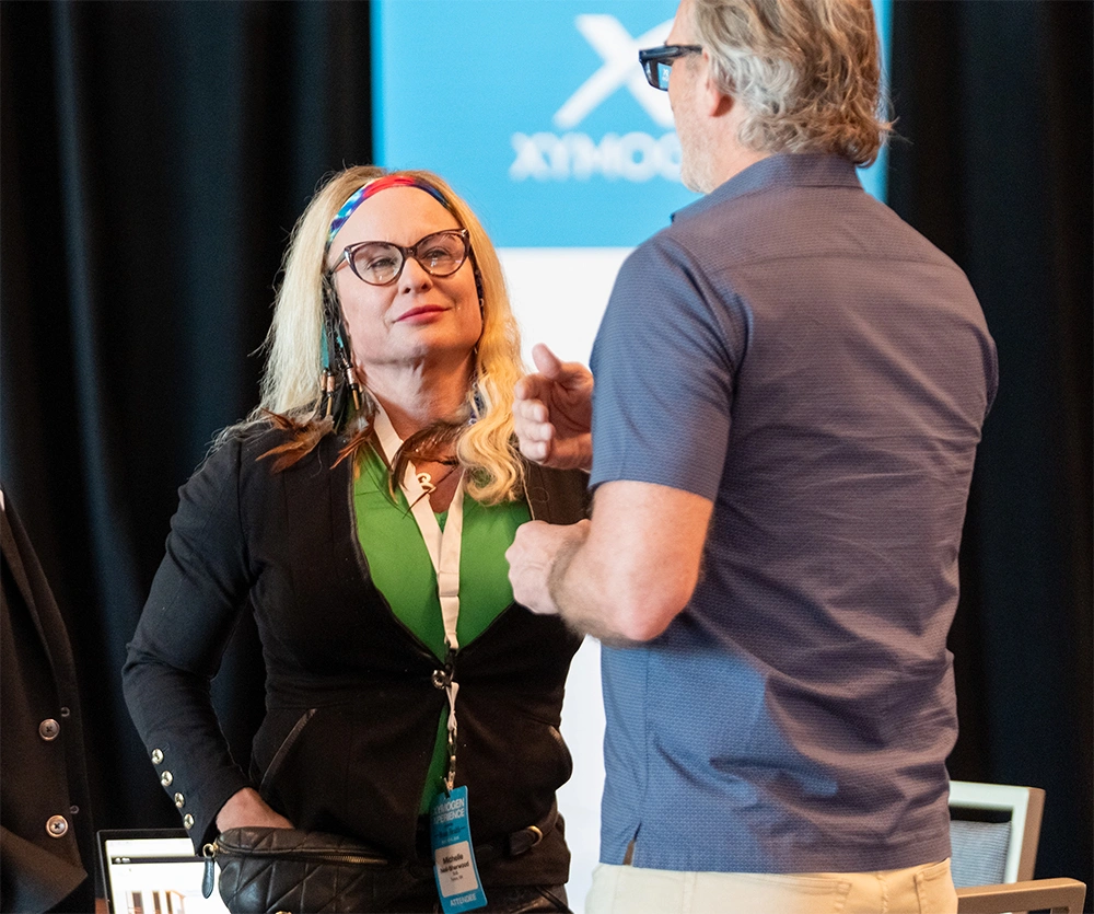 Conference attendees networking at the event